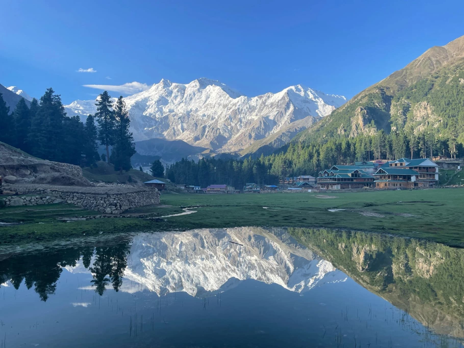 A turquoise alpine lake surrounded by the mountains of Skardu